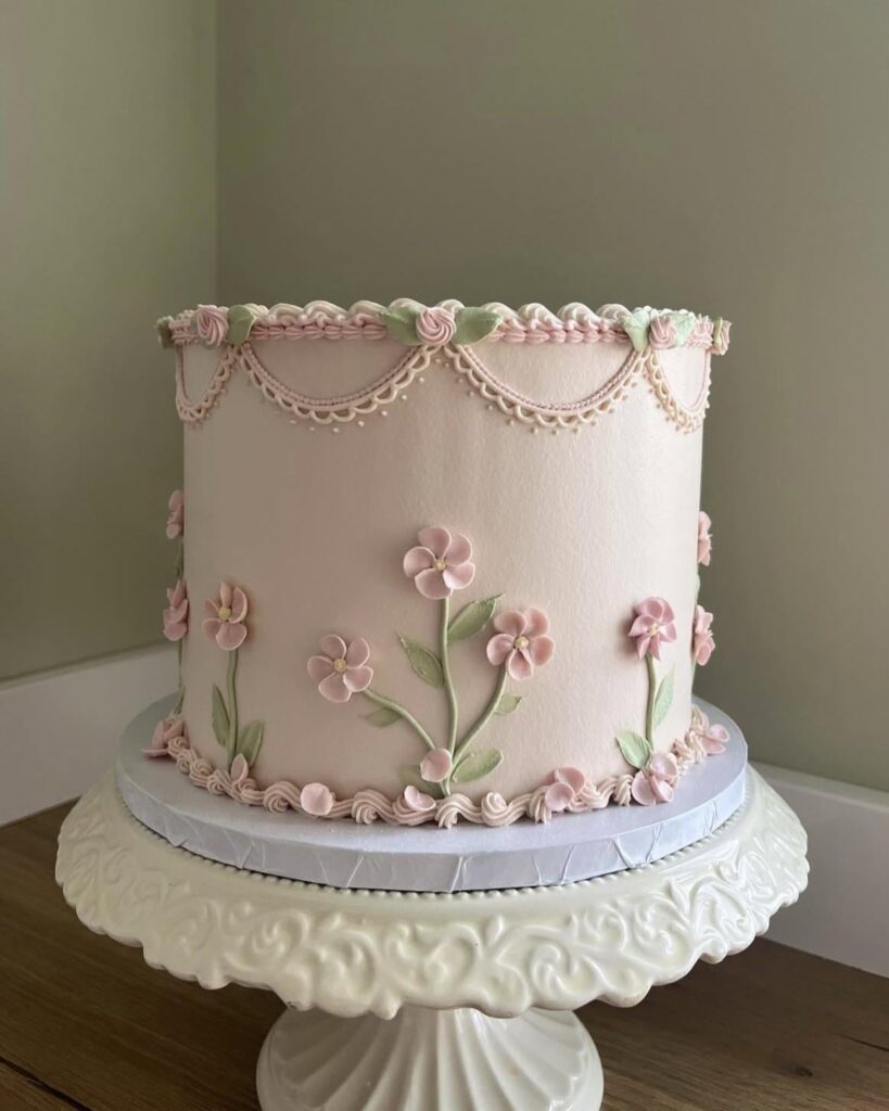 Subtle pink, regency style cake with a floral twist!