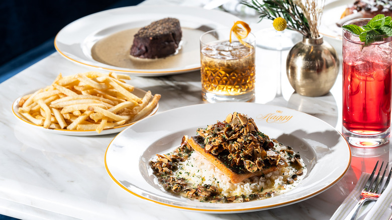 Trout almondine, beef tenderloin, pommes frites, and cocktails from Chez Maggy