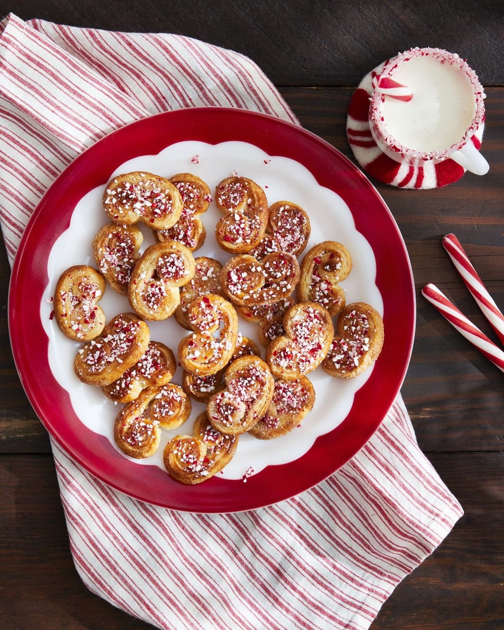 peppermint palmiers arranged on a white plate with red trim