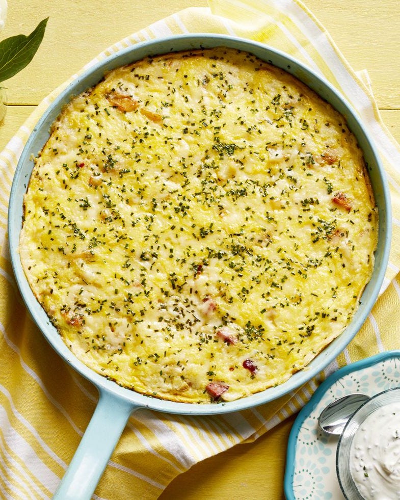 ham and cheese frittata with caramelized onions in pan