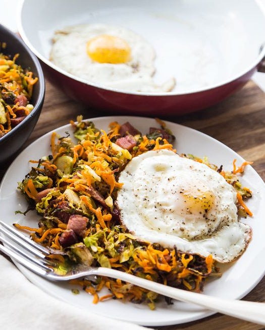 roasted ham shredded brussels sprouts hash with fried egg