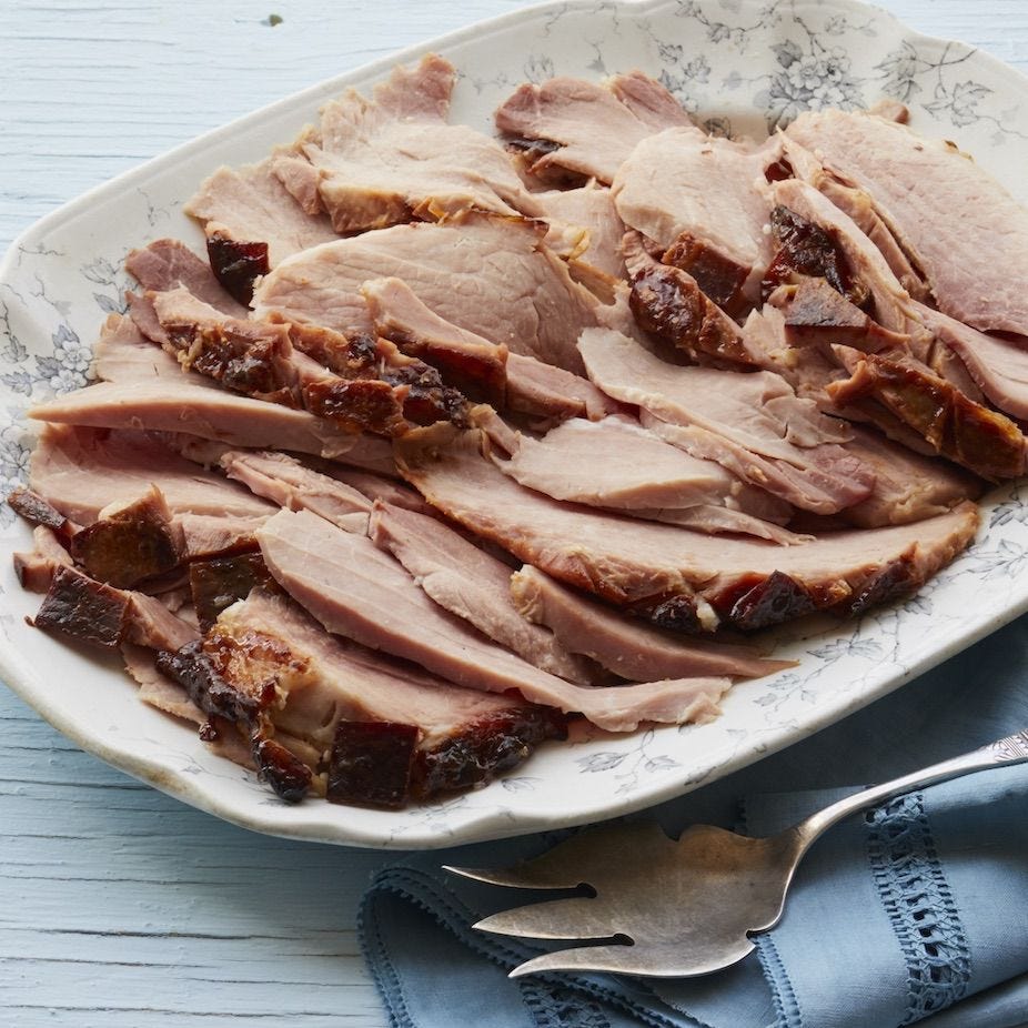 root beer glazed ham sliced on platter
