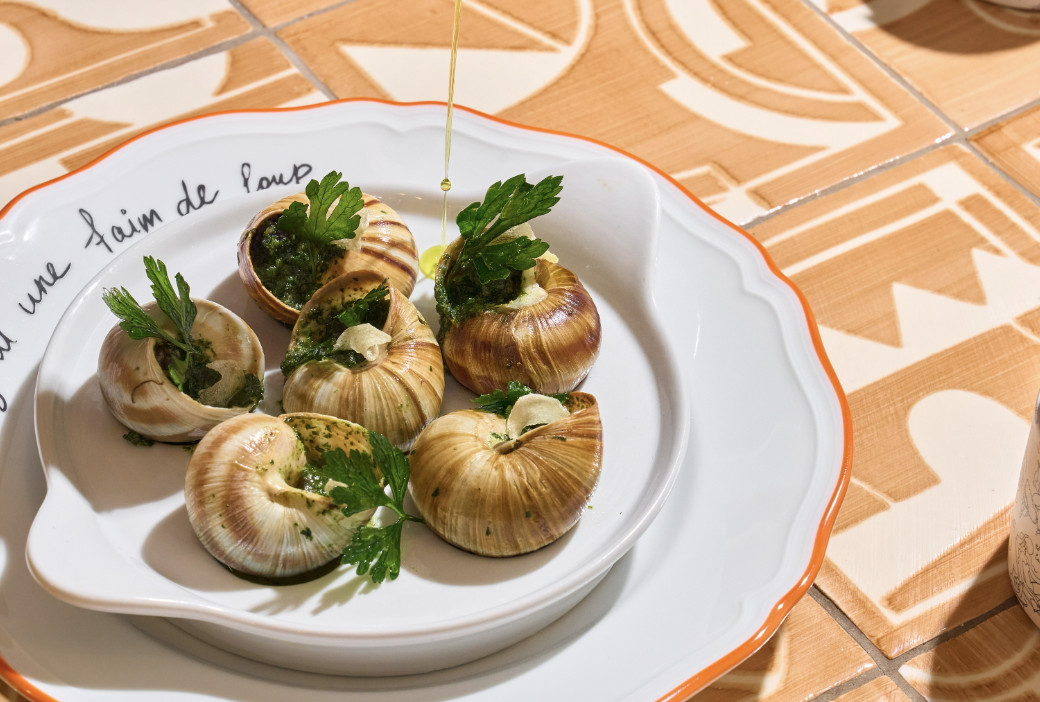 A plate of six escargot. 