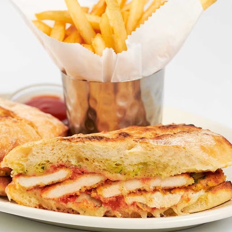 grilled chicken sandwich with fries and dipping sauce