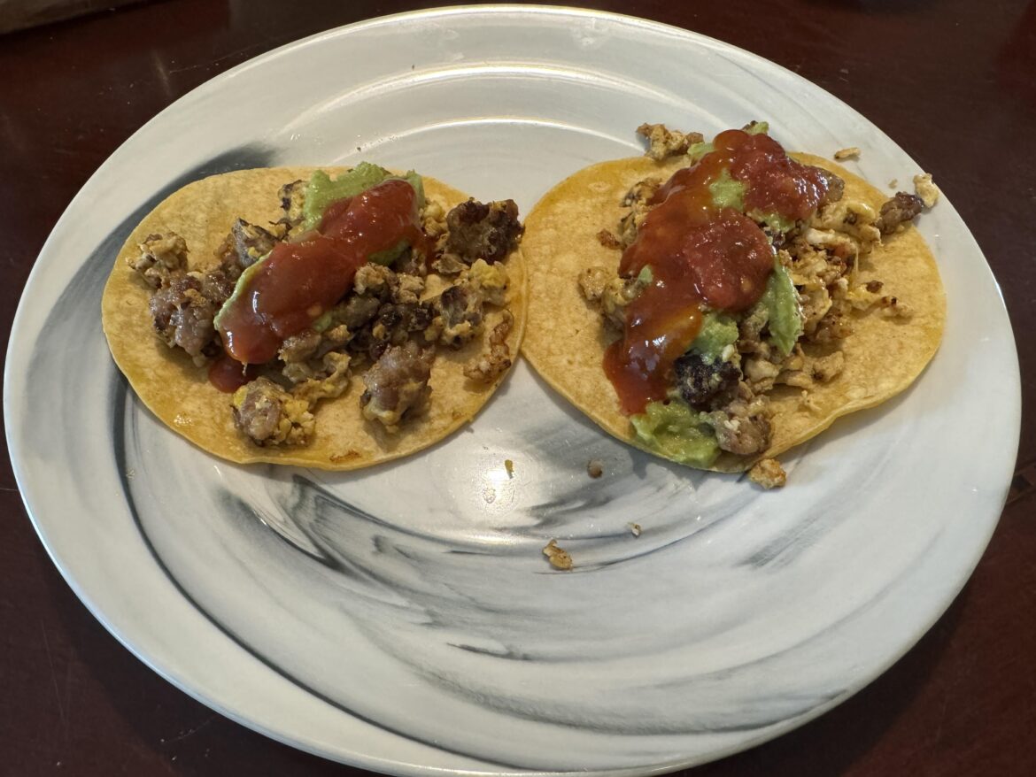 Sausage, egg, guacamole salsa on corn tortilla tacos 🌮
