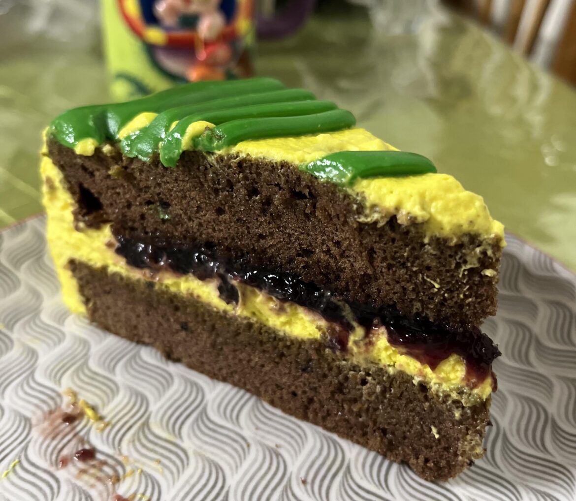 Chocolate cake with cherry filling and cream