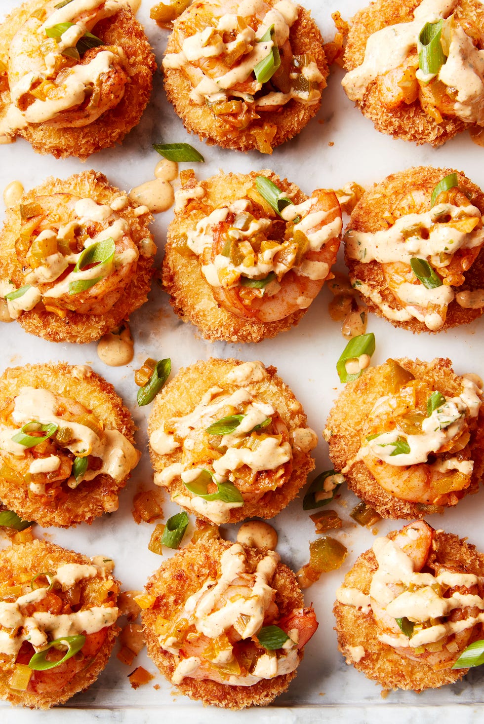 smoked gouda grits, breaded and fried until crispy then topped with cajun seasoned shrimp and creamy remoulade sauce