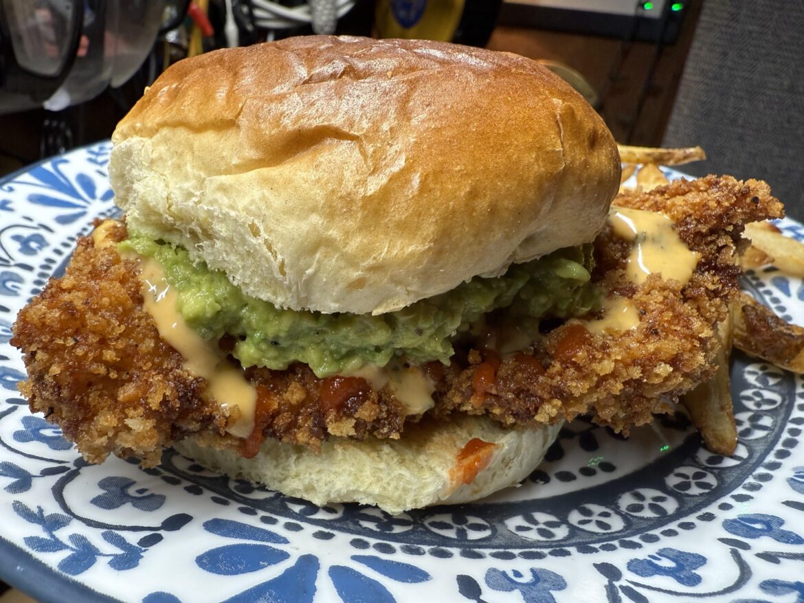 Home made Katsu chicken sandwich topped with guacamole, Sriracha & spicy Mayo
