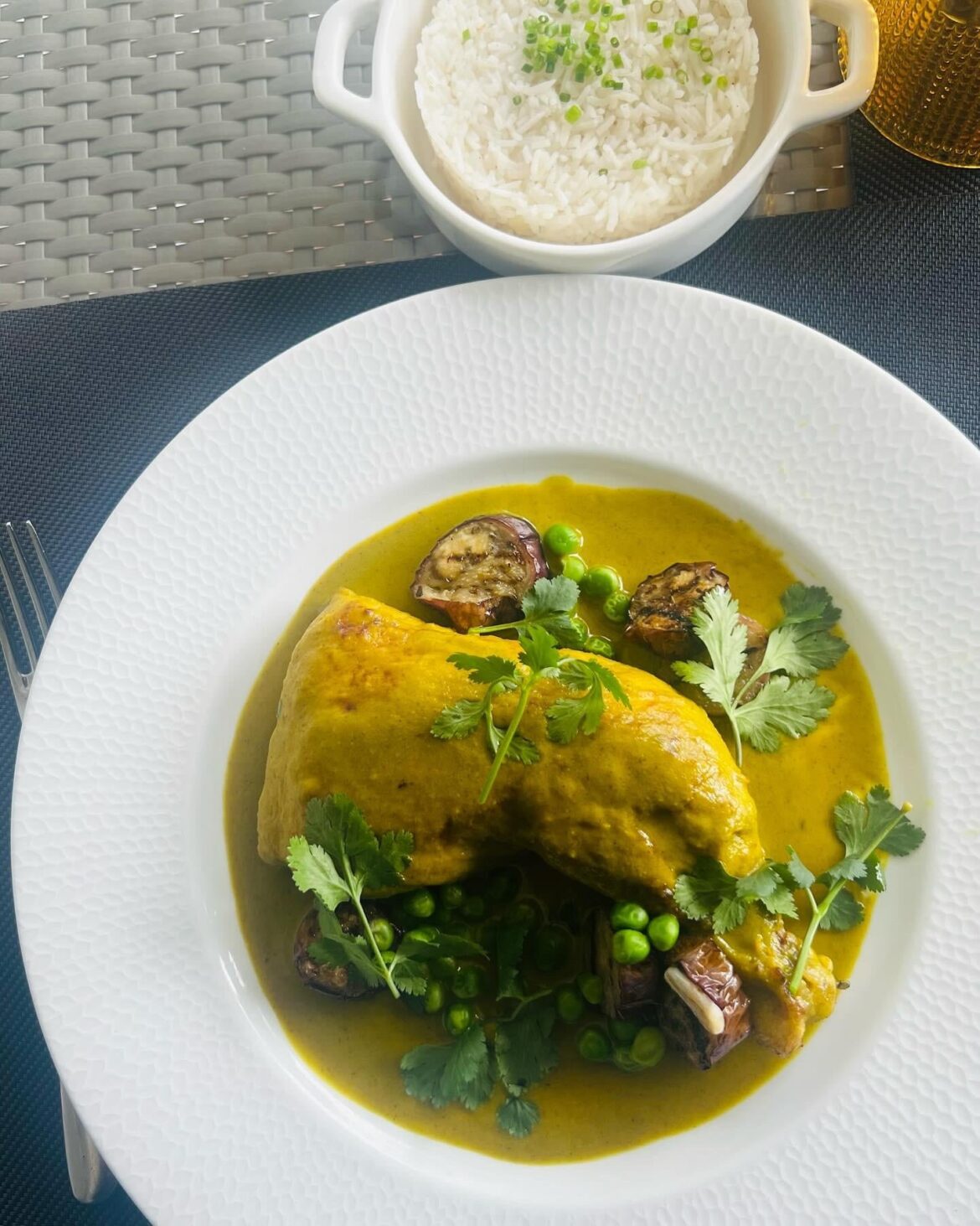Thai Green Curry with English Pea, and Marinated Eggplant, served with Jasmine Pilaf