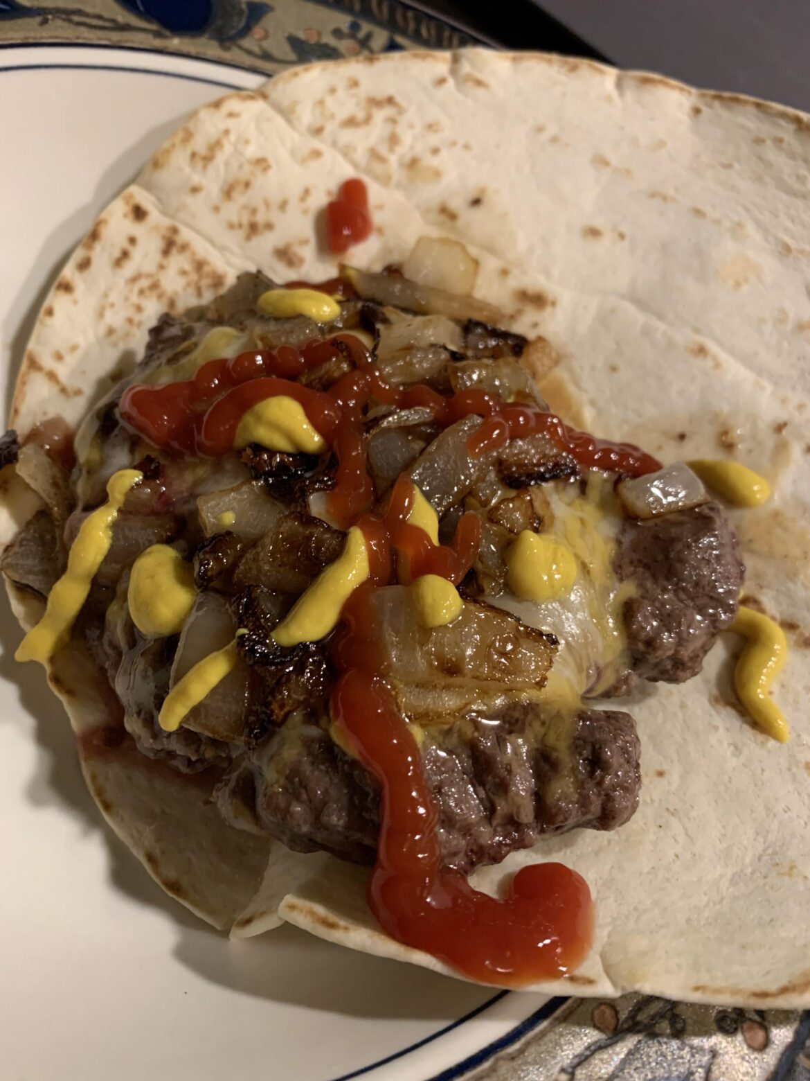 i was about halfway through cooking this burger when i realized my last bun had gone moldy so it’s tortilla time