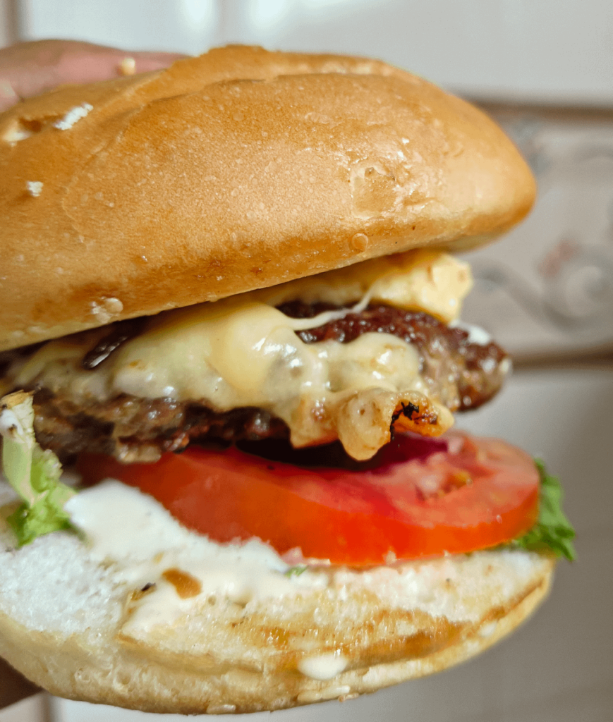 Look at this yummy cheeseburger I made today.(With cheddar cheese, homemade mayo and caramelized onions)