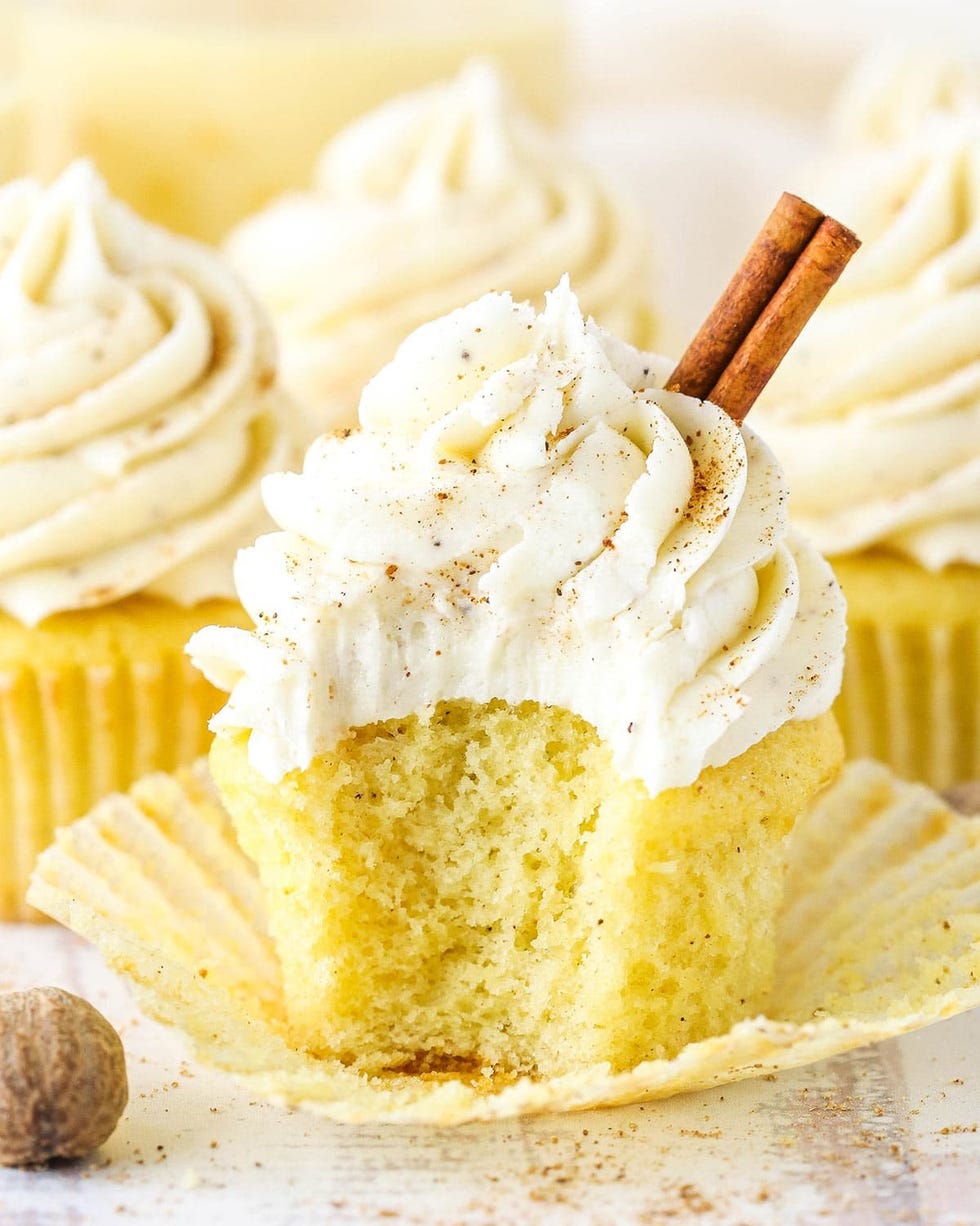 eggnog cupcakes with frosting and cinnamon stick