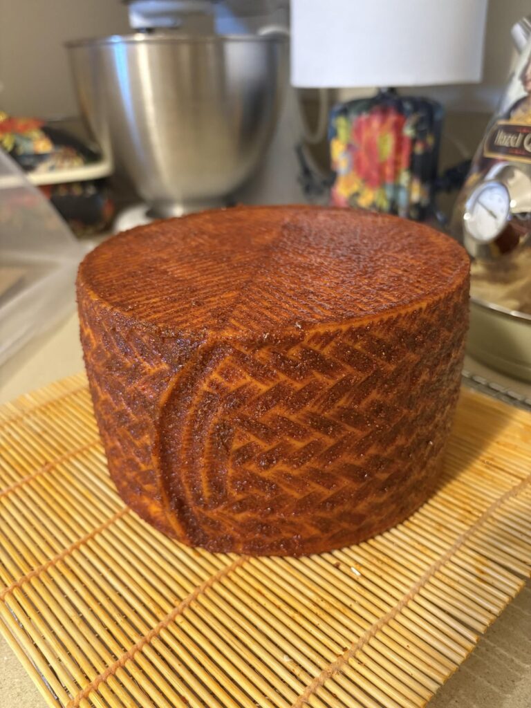El queso del Diablo. Fresh coat of cayenne and ghost pepper oil rub with a little smoked paprika and garlic thrown in. Needs to age another two and a half months. It will get brushed and recoated several times yet. 🔥