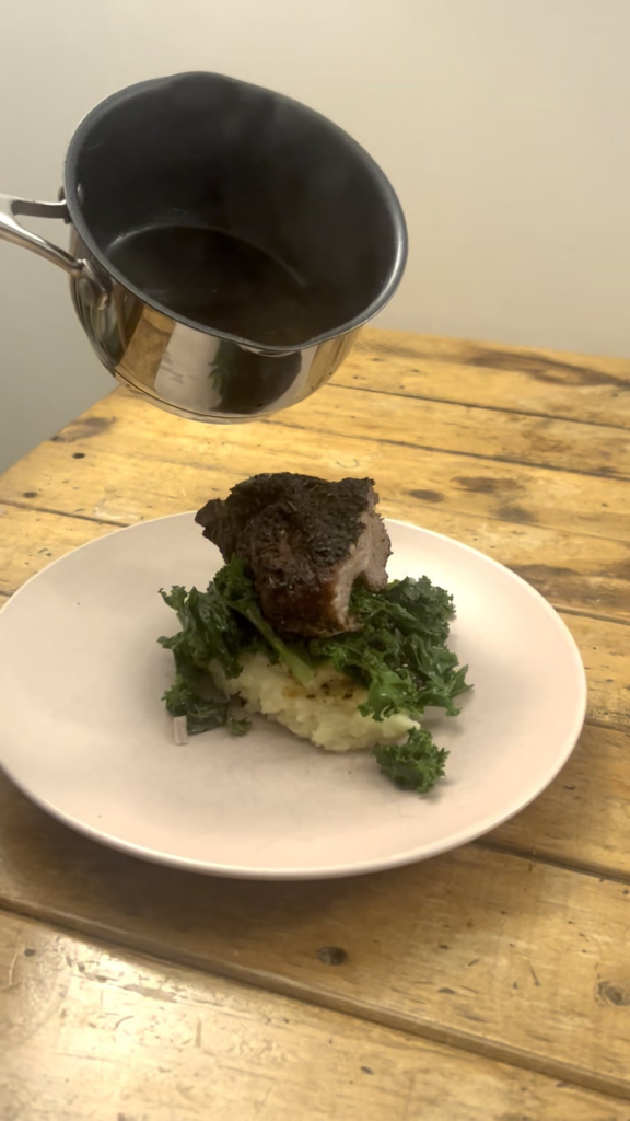South African spiced lamb ribs, garlic shallot and tyme mash, lemon zest shallot sage and thyme kale with a mint jelly and Rioja wine gravy