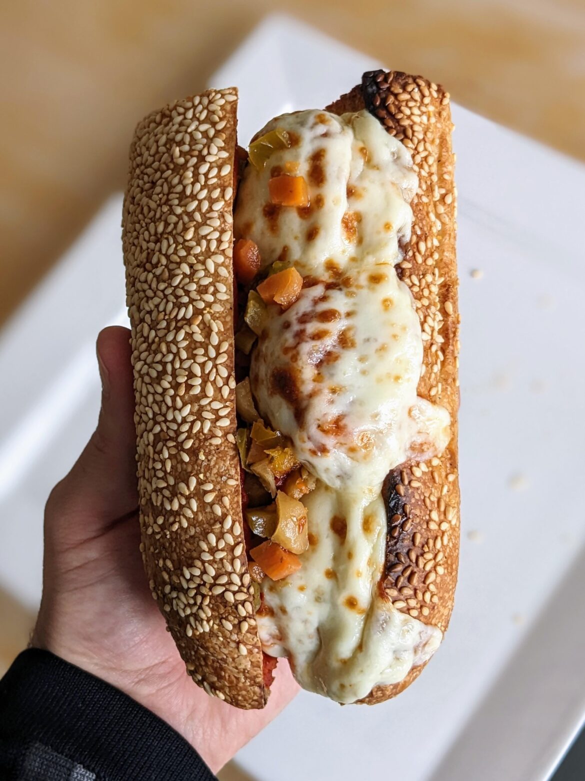 Meatball sub on homemade sesame roll