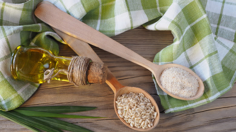 Spoonfuls of rice and bran as well as rice bran oil in a bottle