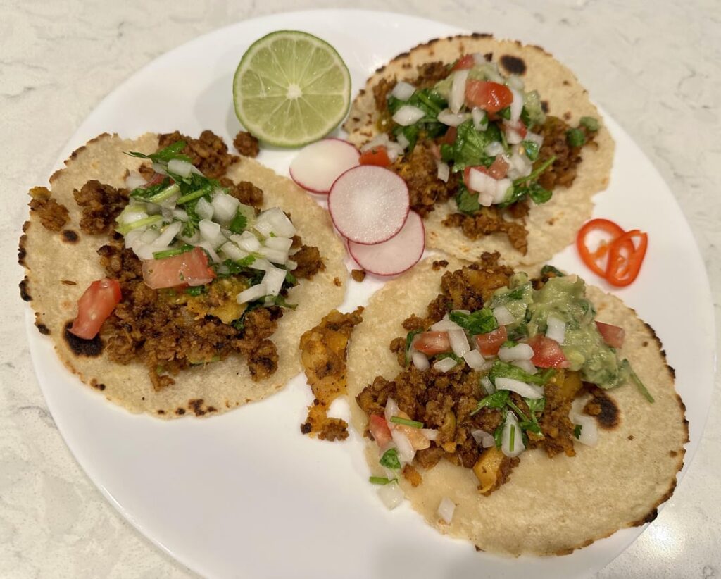 Chorizo con Papas Tacos with chile de arbol/guajillo/roasted serrano/tomatillo salsa