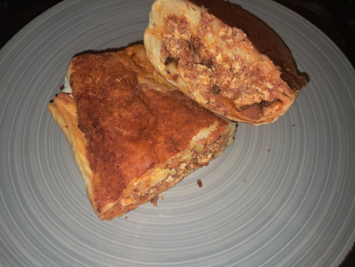 Grilled cheese breakfast burrito with Chorizo egg and potatoes