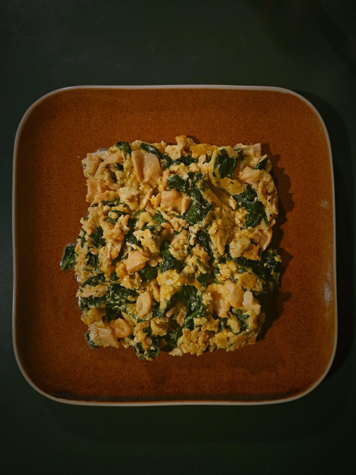 Salmon, spinach and cheese scrambled eggs.