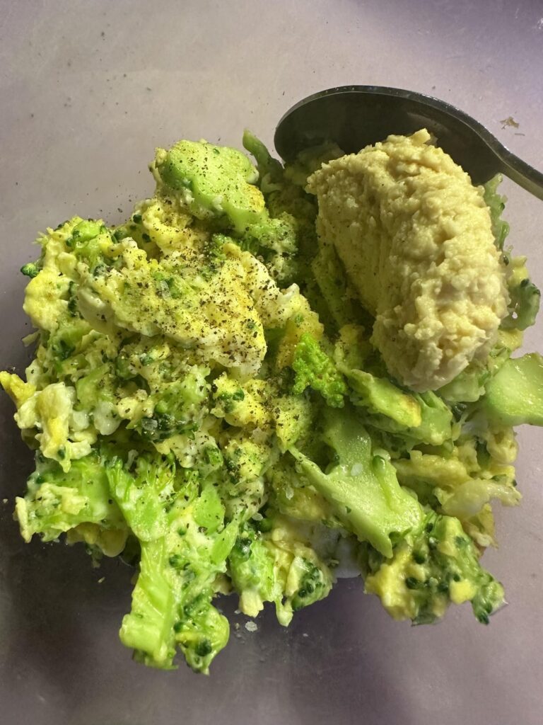 Broccoli scramble and a dollop of garlicky hummus