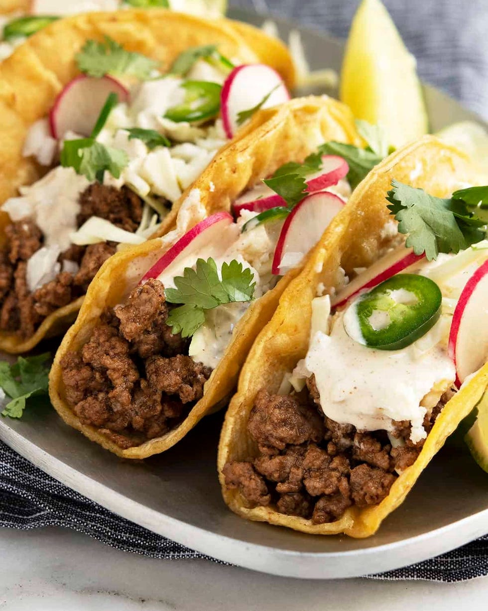 lamb tacos with radishes sour cream and jalapenos