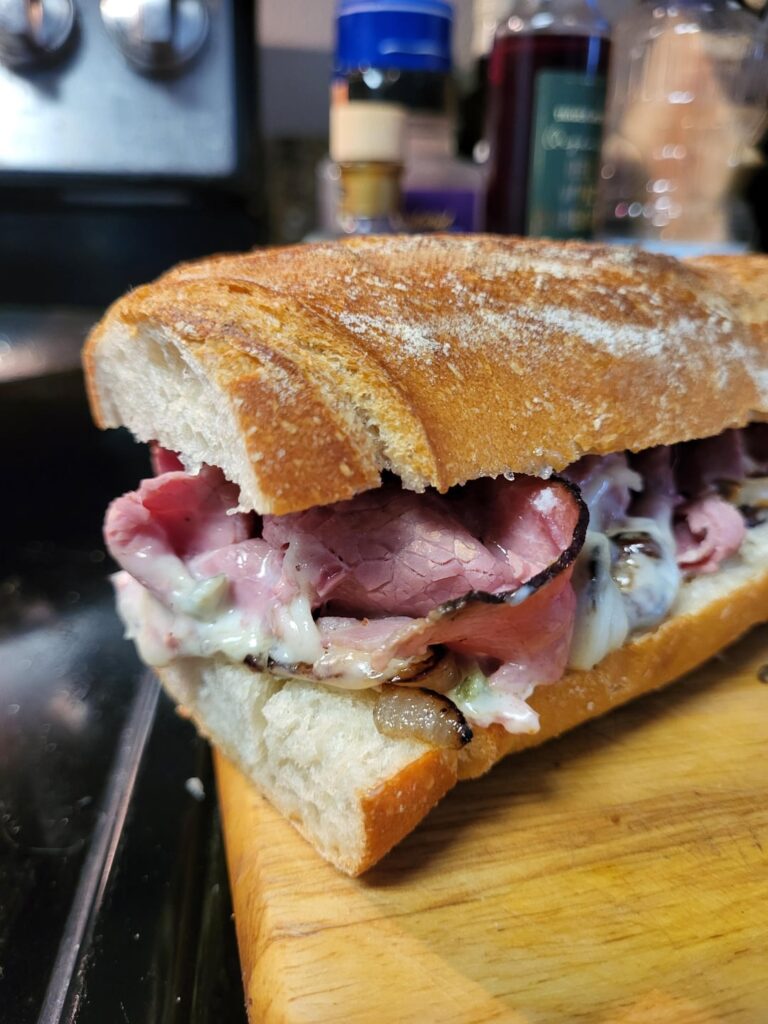 Pastrami inspired cheesesteak? Pastrami, münster bescamel, fried onions w. garlic spread.