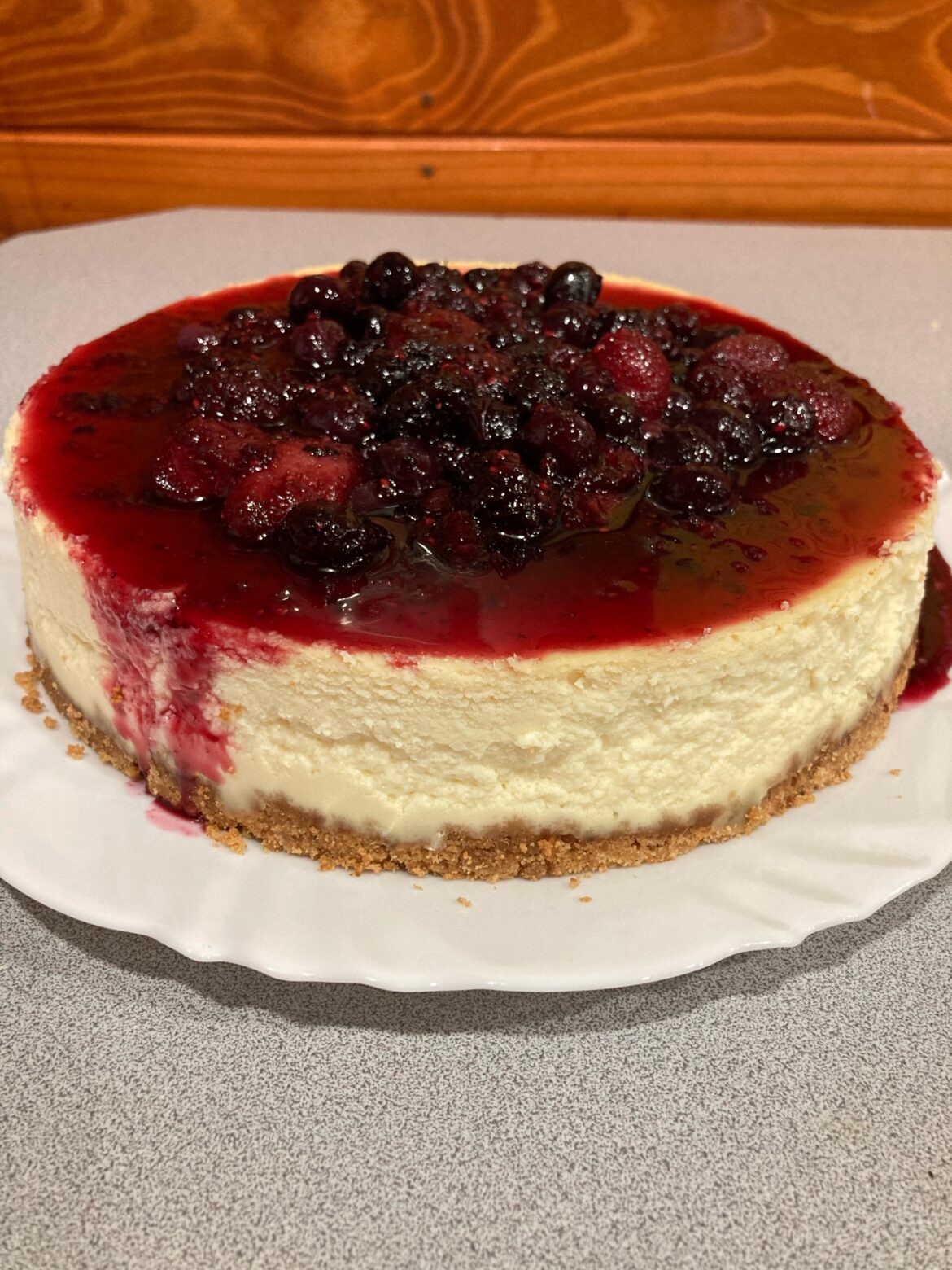 Cheesecake with red fruit sauce