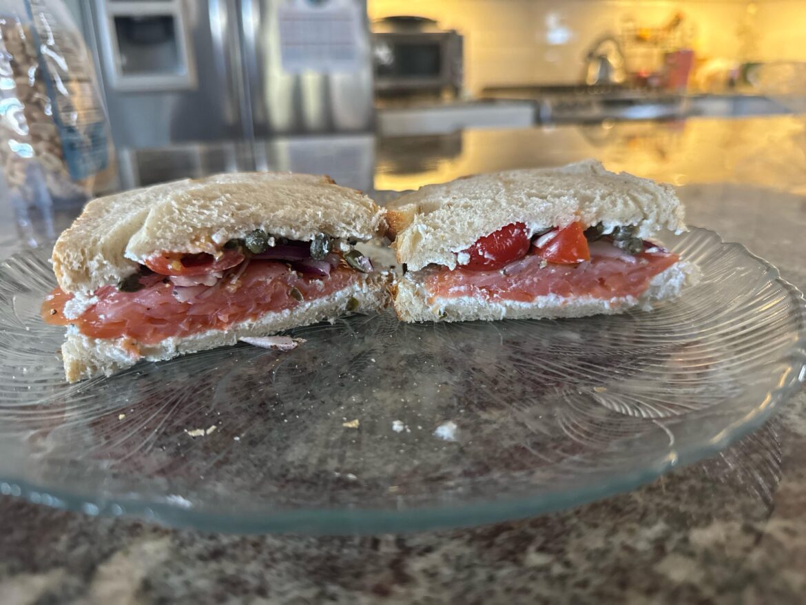 Smoked salmon, goat cheese, tomato, onion, caper, black pepper on toasted sourdough