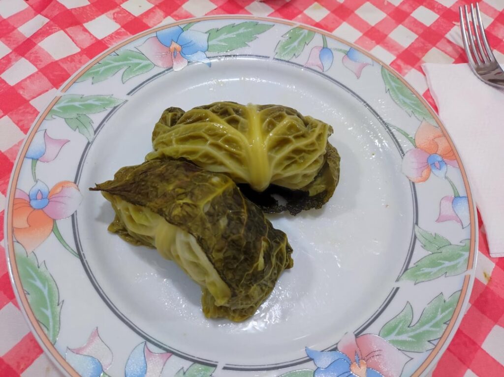 cabbage roll stuffed with minced beef and pork, bread and grated cheese (involtino di verza ripieno di manzo e maiale tritato, pane e formaggio grattugiato)