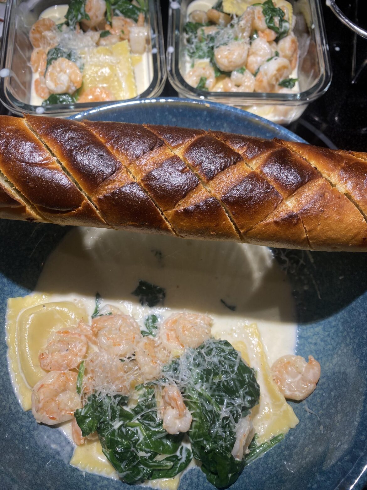 Creamy garlic, shrimp with ricotta, ravioli, and some of the bread add on.