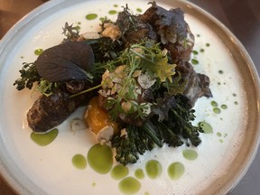 A scallop dish dotted with green oil