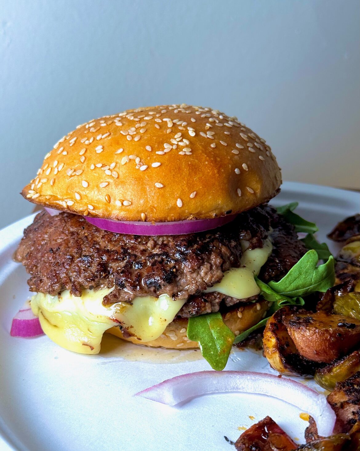 A quick double smash - Pepper jack, pesto mayo and red onion.