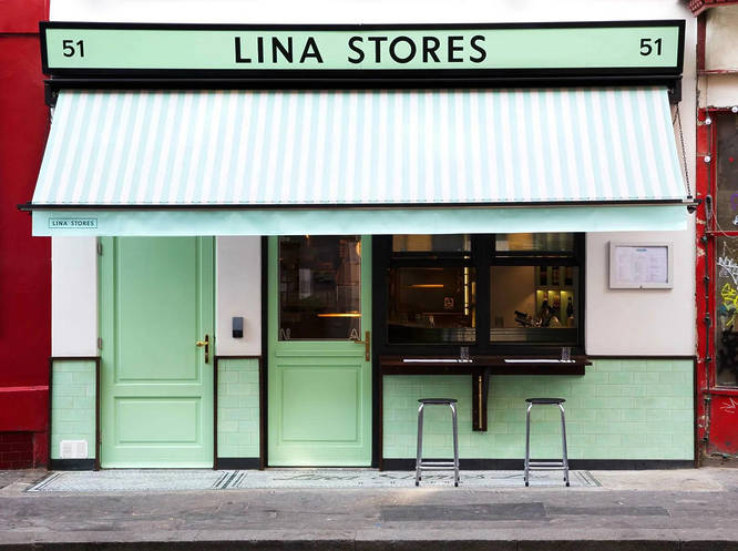 Photograph of the exterior of the cafe showing its famous mint green paint