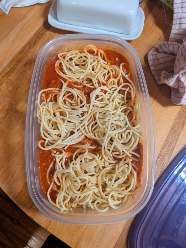 If you're like me and cook extra portions of spaghetti, keep noods and sauce separate! That way you can separate the noods into portions that you can take out to reheat (instead of reheating the huge tub constantly).
