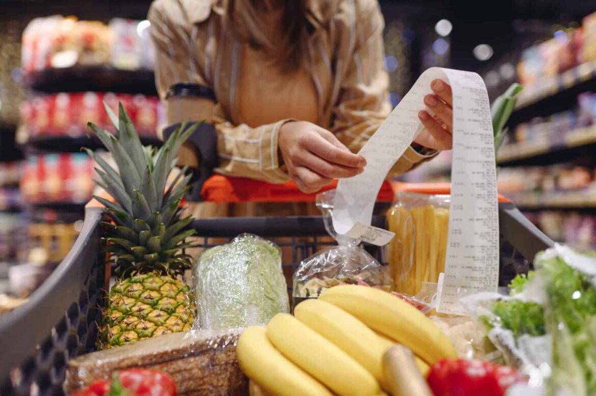 women shopping and looking at receipt