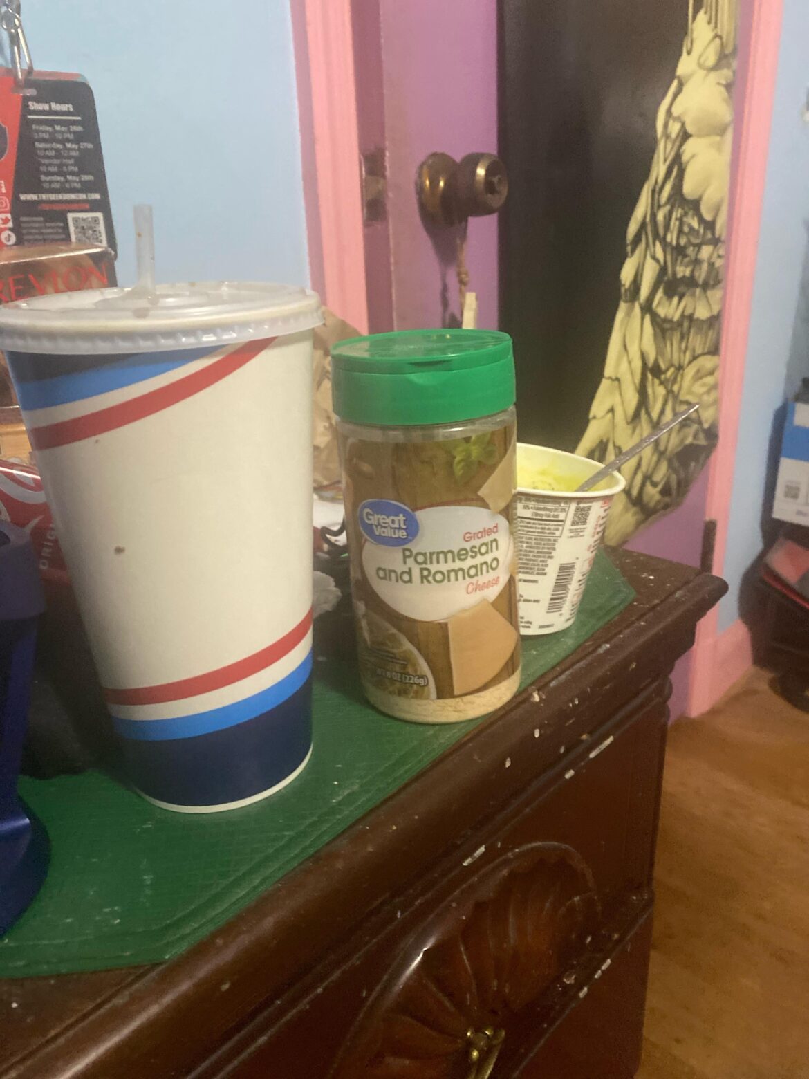 Why does prepackaged grated Parmesan cheese taste spicy?