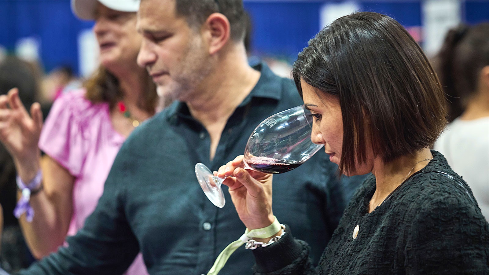  An attendee tasting wine at the 2024 Palm Beach Food & Wine Festival