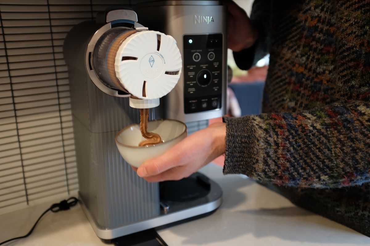 The Ninja Swirl by Creami ice cream maker making chocolate soft-serve