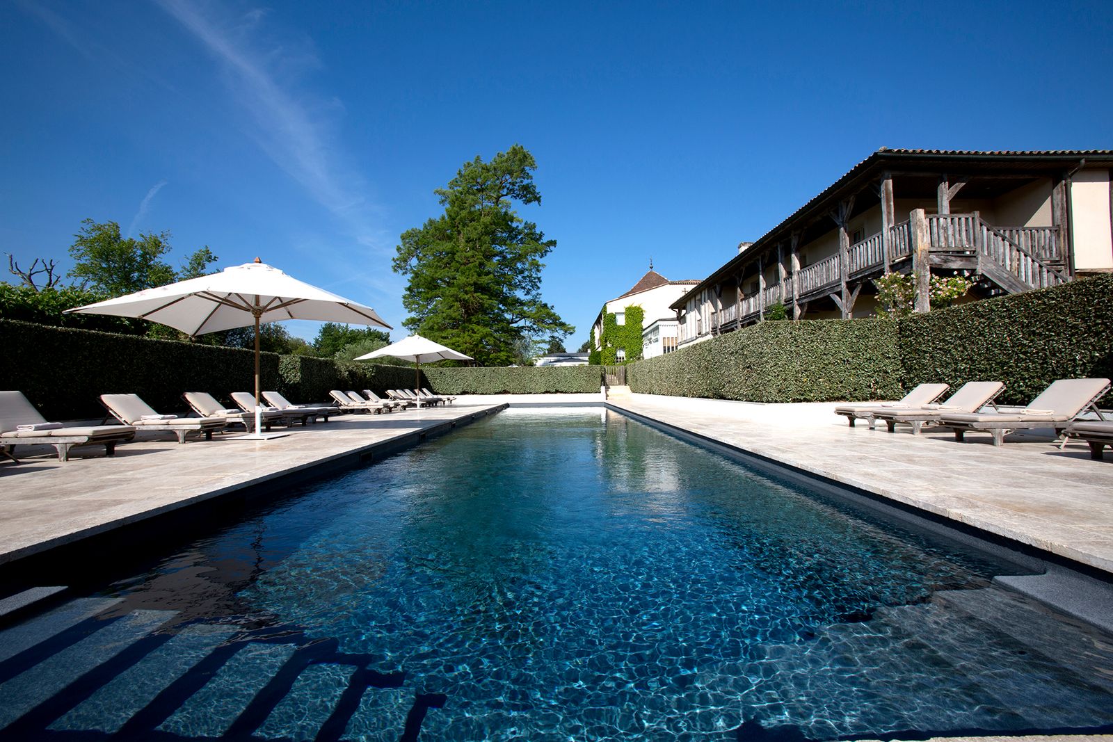 Image may contain Resort Building Hotel Pool Water and Swimming Pool