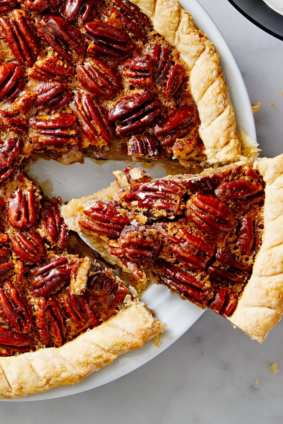 pecan pie with crunchy pecans and a flaky crust
