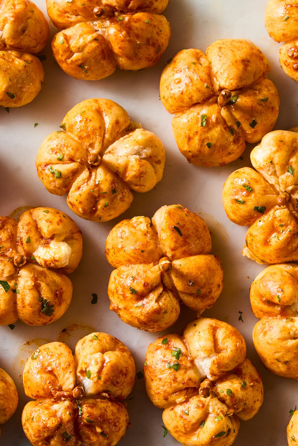 mini pumpkins made out of pizza dough stuffed with cheese