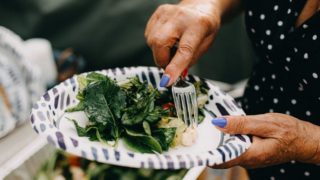 leafy green salad on paper plate