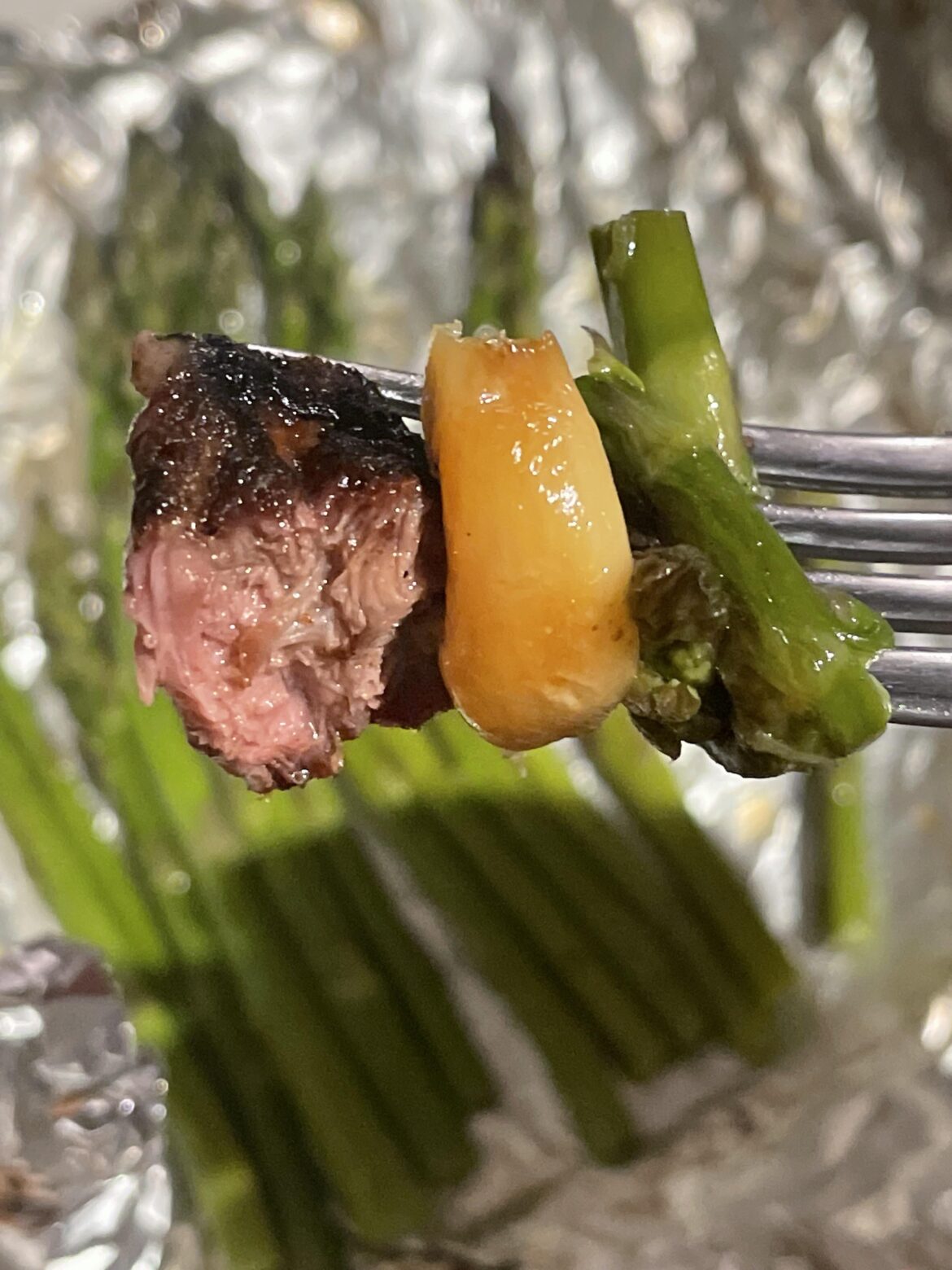 Bone in rib-eye, grilled asparagus and roasted garlic over charcoal for the win