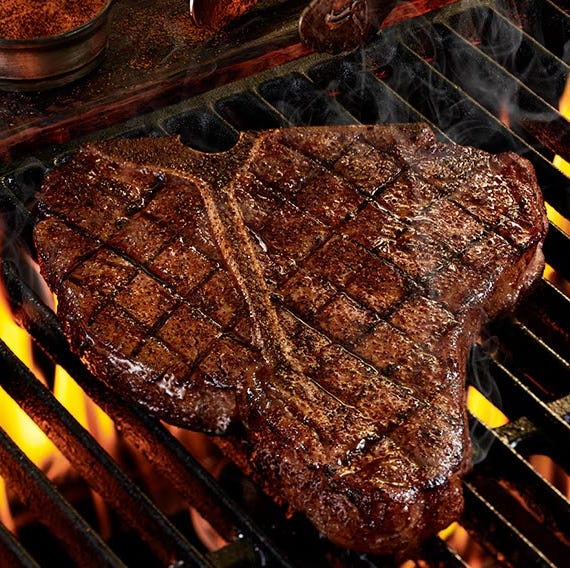 grilled tbone steak on a barbecue grill