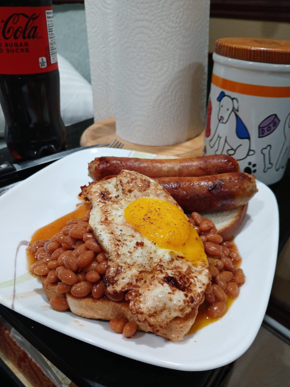 Beans on toast, sausages, with an egg on top.  Finally got the egg yolk right!