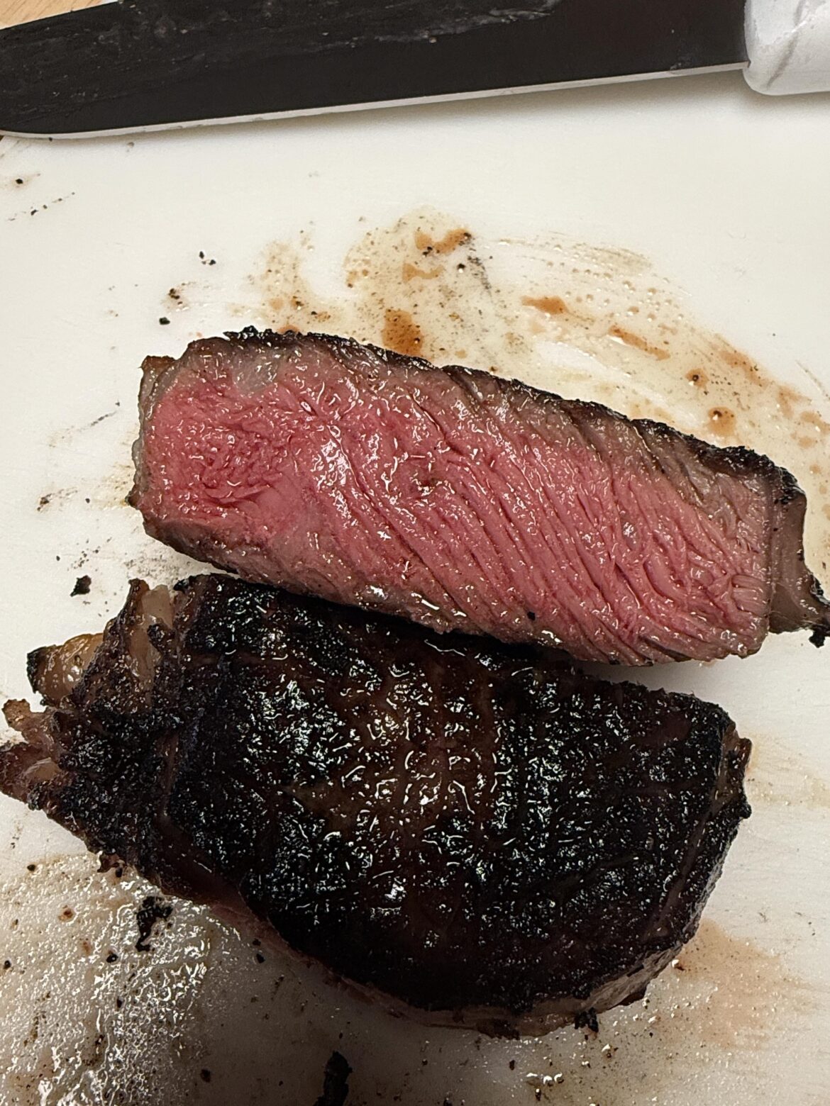 Inexpensive ribeye on the grill. Came out pretty good for my taste.