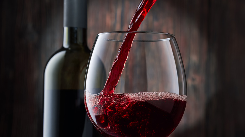 pouring red wine
