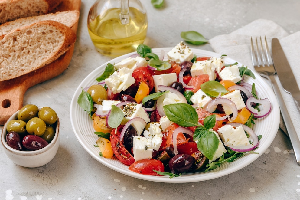 PHOTO: Greek salad with feta cheese, fresh tomatoes, basil, onion olives and olive oil, healthy food.