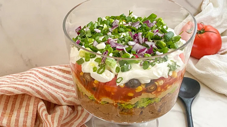 Large dish of vegan seven-layer dip