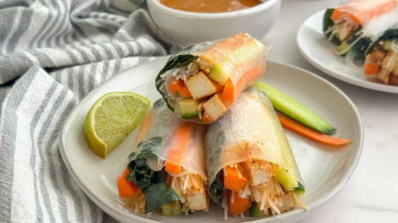 Spring rolls with tofu and veggies on plate